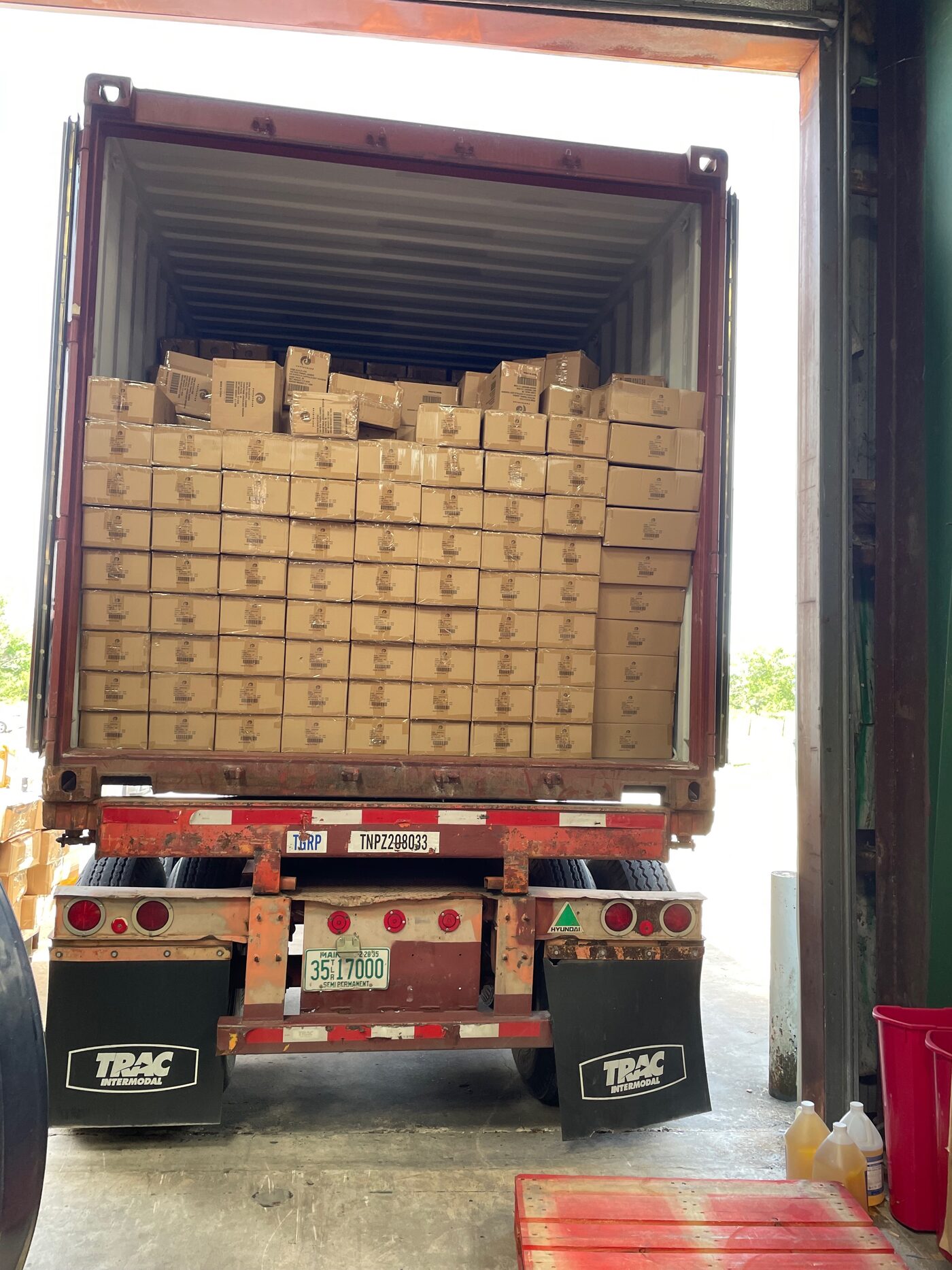 Container of floor-loaded cartons arriving for FBA prep