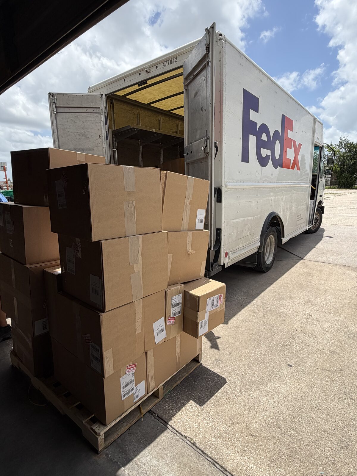 FedEx truck loading outbound cartons at FlexPrep's dock