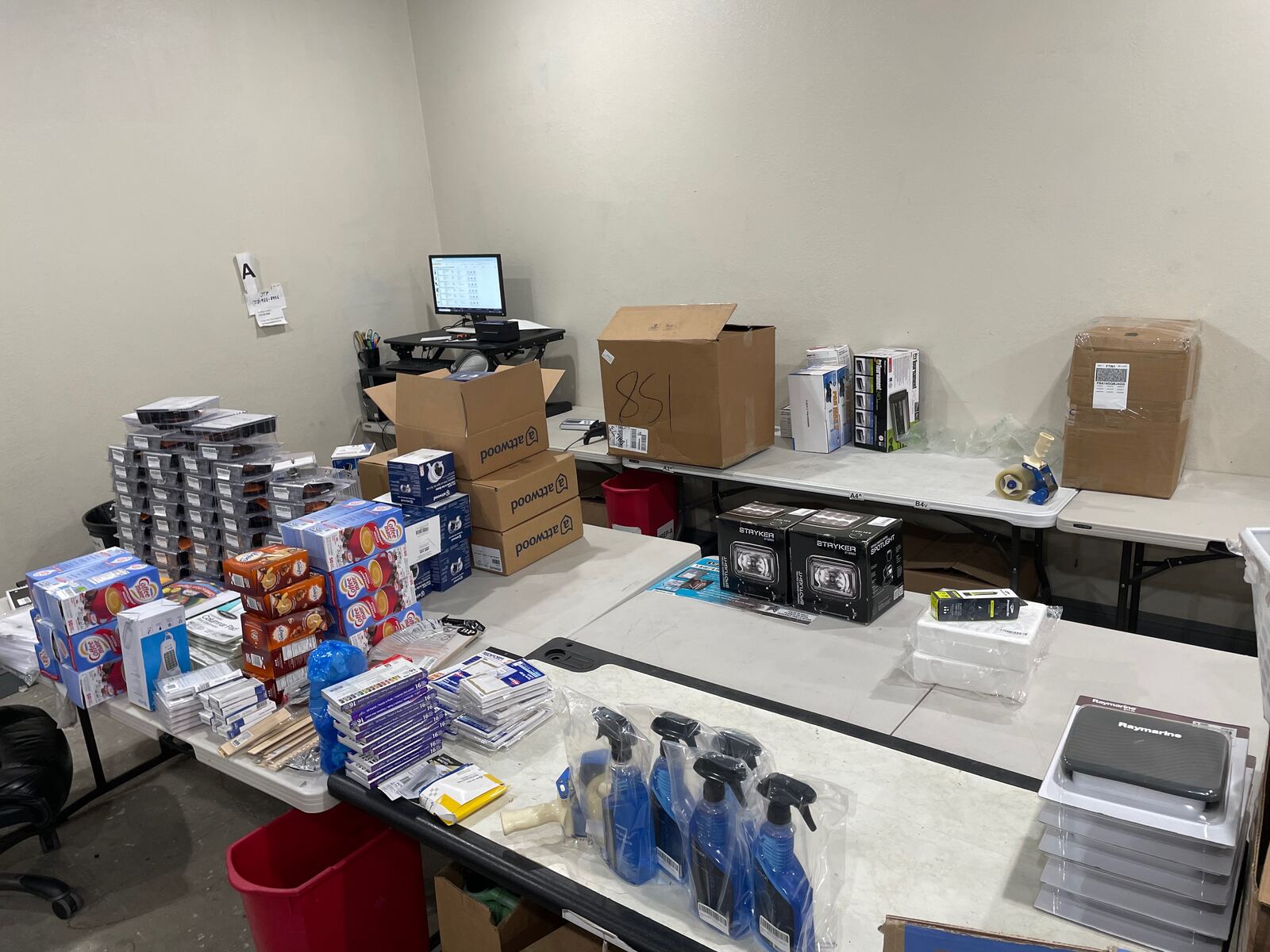 Prep and rework stations at FlexPrep with retail products inspected, labeled and repackaged for FBA