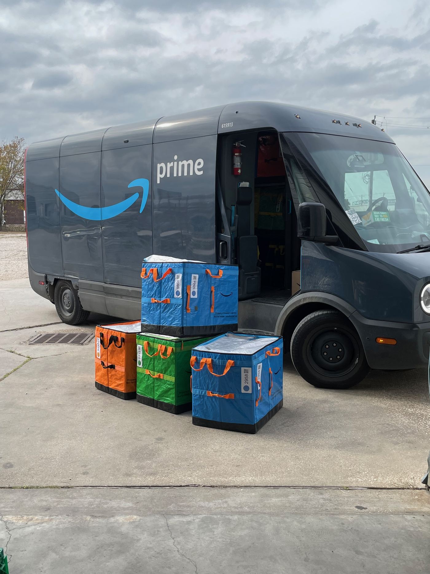 Amazon delivery van dropping off FBA Removal Order totes at FlexPrep